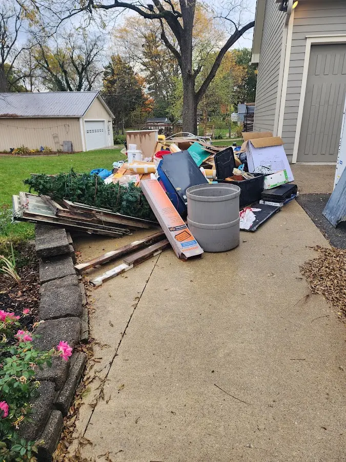 Dumpster being loaded with debris for Residential Dumpster Rental in Tuscarora